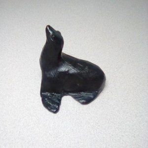 Free with purchase. Canada carved black seal sculpture made of Nova Scotia coal